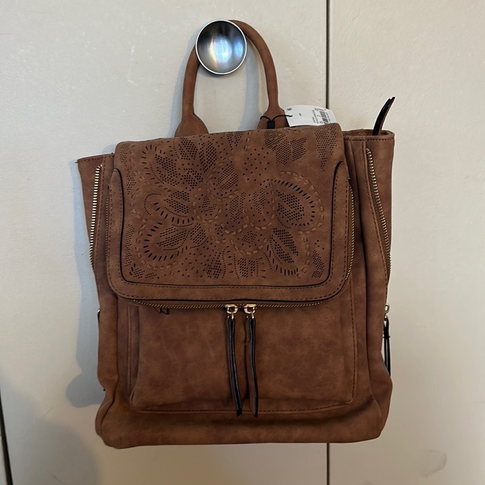 Small suede backpack. Great for carrying everyday belongings. New with tags.